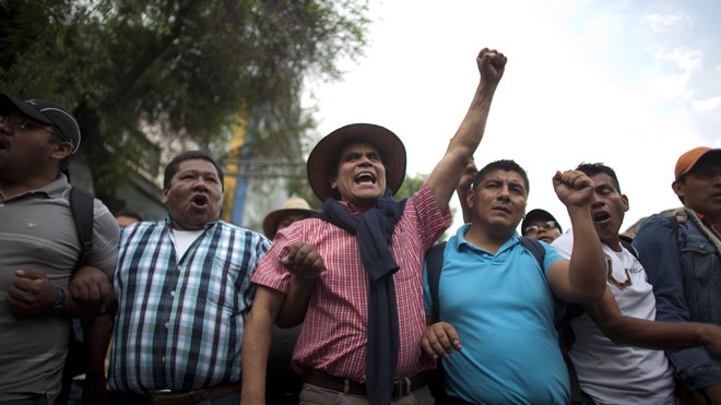 Public school teachers shout slogans while protesting in Mexico City, Thursday, April 4, 2013. Radical Mexican public school teachers are holding marches and blocking roads to battle a newly enacted education reform that would weaken union powers. (AP Photo/Alexandre Meneghini)