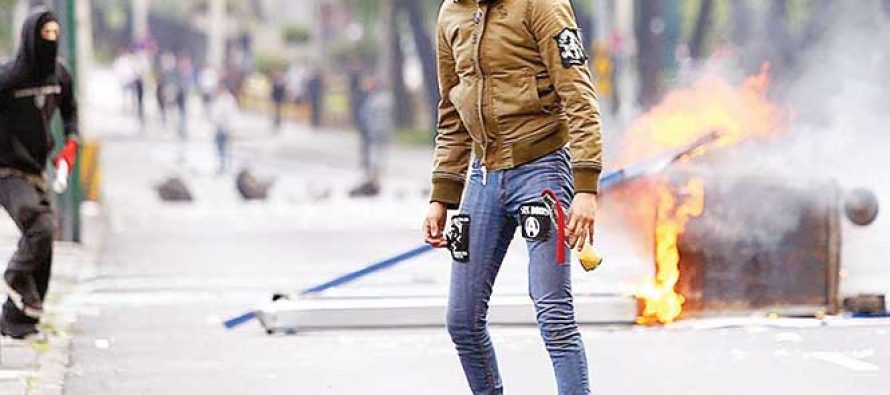 Anarchists blockade Avenida Insurgentes Sur in Mexico City on Wednesday.
